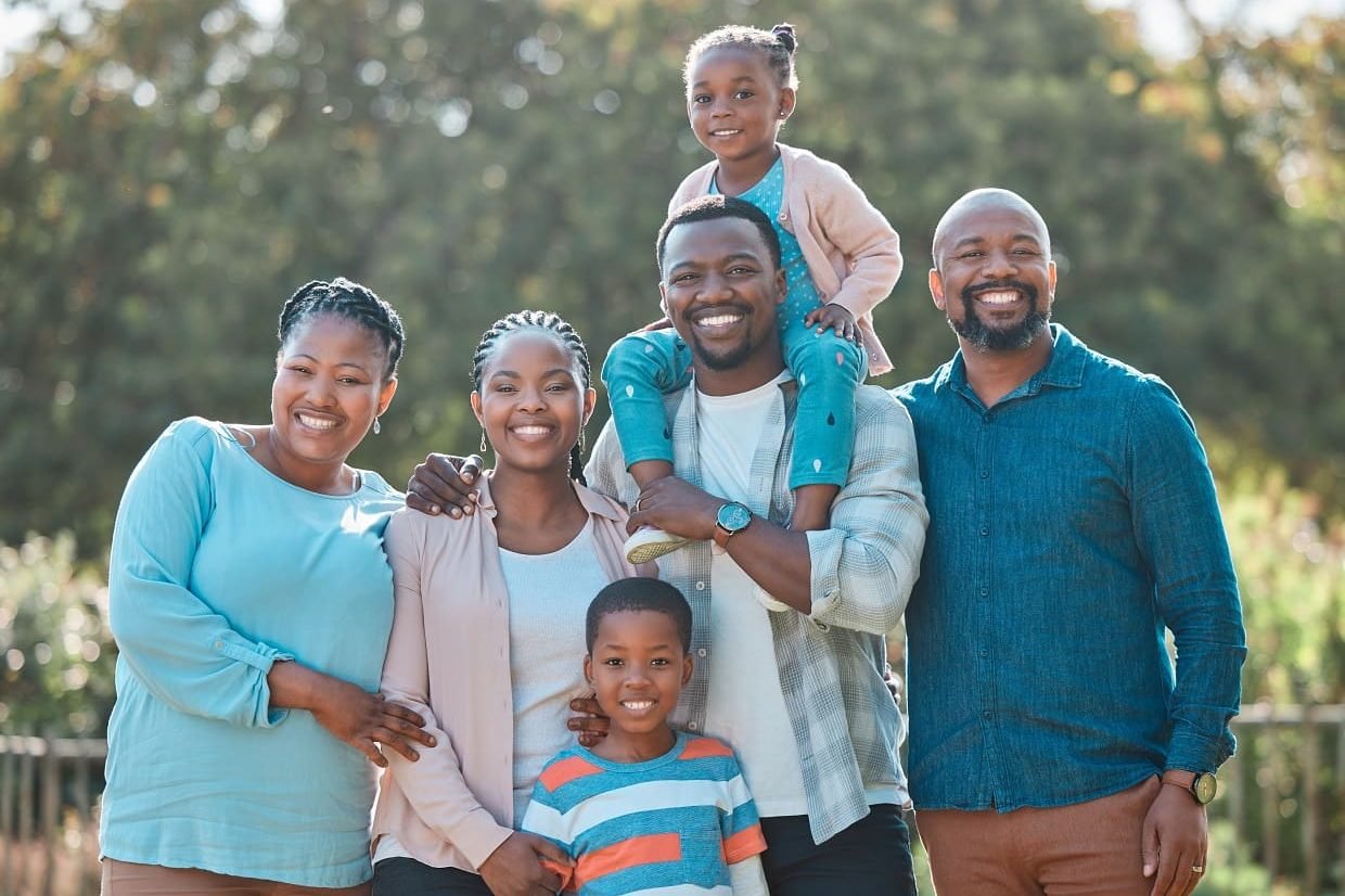 shot-of-a-multi-generational-family-standing-toget-2023-11-27-05-35-25-utc